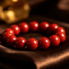 Cinnabar red beaded bracelet on dark silk, spiritual protection jewelry