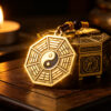 Taoist Bagua protection amulet pendant with golden glow, spiritual protection charm